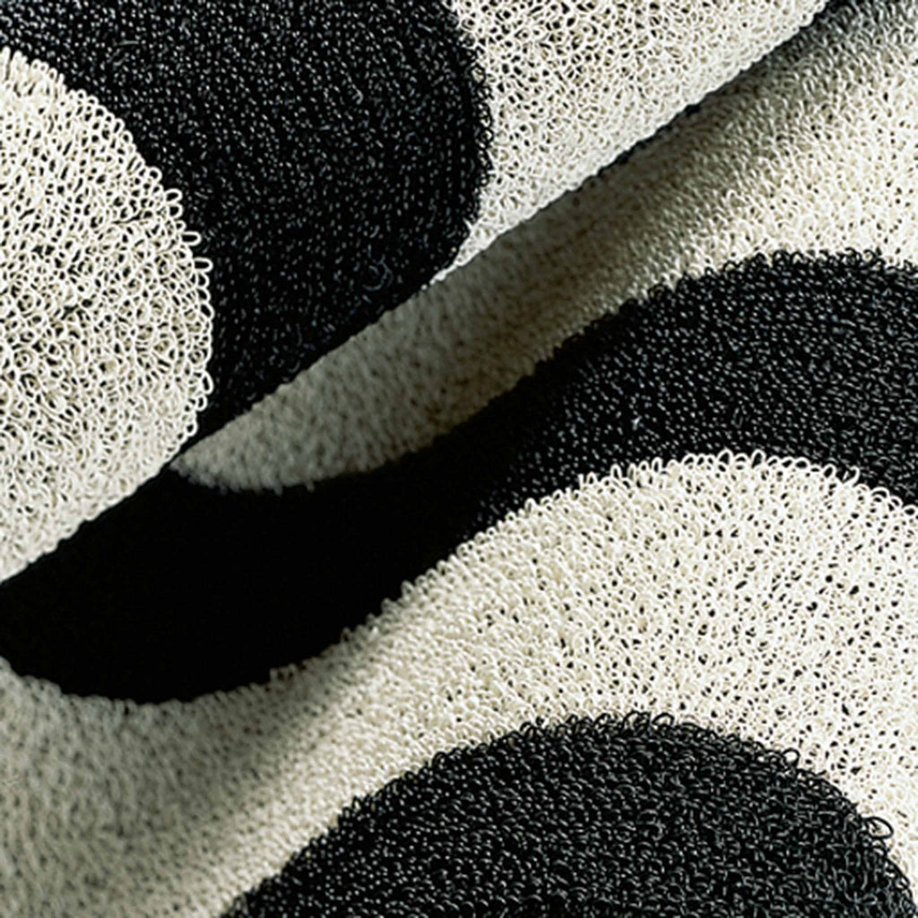 Shag Indoor/Outdoor Mats by Chilewich. Black/White 200126-002. UPC 0667880108822. Tufted, crush-proof texture created by looped TerraStrand yarns. Resistant to mold, mildew, and chlorine.  Quick-drying surface. Free of phthalates.