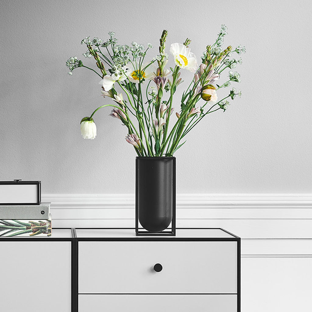 Whether it stands alone or as part of a collection of items, it looks crisp yet feminine when filled with light, colorful blooms. With its simplicity and precision, it also has a strong enough aesthetic to make a statement all on its own.