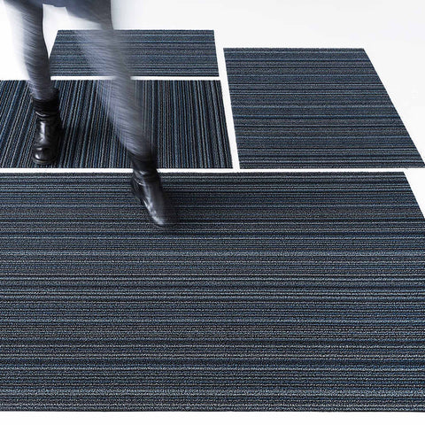 Chilewich Shag Indoor/Outdoor Mats are made by tufting custom extruded yarns as loops onto a primary backing and then binding them onto a hardworking vinyl backing that can weather any storm outdoors and provides functionality underfoot indoors.