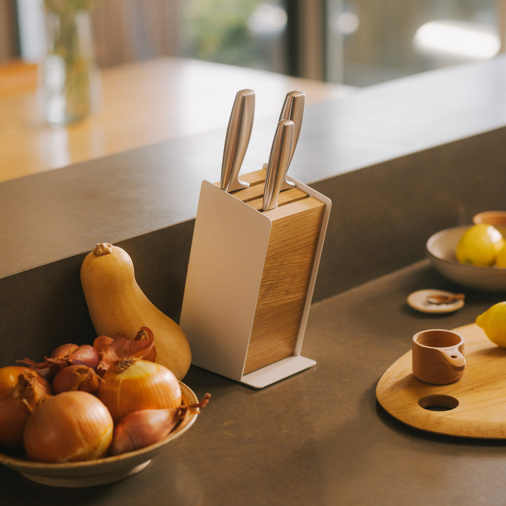 APTO Slot Knife Block - Steel + Wood. A home for your knives that keeps them at their best. Open-slot design promotes natural air circulation while removable components make cleaning simple — protecting your blades and preserving your investment for years to come.