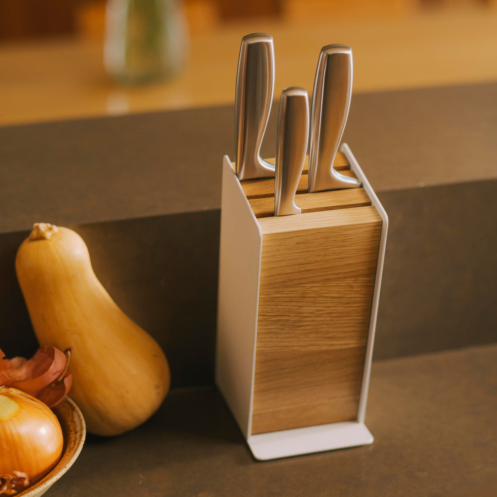APTO Slot Knife Block - Steel + Wood. Universal slots fit most common knife sizes, keeping your collection organized and always within reach. The maximum blade length is 8.5 inches (21.5 cm) for the front slot, 8.8 inches (22 cm) for the middle slot, and 9.3 inches (23.5 cm) for the back slot.
