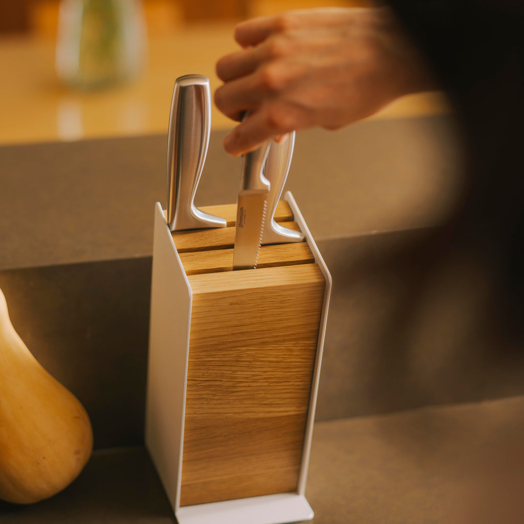 APTO Slot Knife Block - Steel + Wood. SKU 10484. A universal knife block with slots for most knife sizes, removable components for easy cleaning, and a warm wood and steel design for any kitchen. The wood pieces are easily removable for cleaning with a soft, damp cloth.
