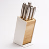 A universal knife block with slots for most knife sizes, removable components for easy cleaning, and a warm wood and steel design for any kitchen.

A home for your knives that keeps them at their best. Open-slot design promotes natural air circulation while removable components make cleaning simple — protecting your blades and preserving your investment for years to come. Universal slots fit most common knife sizes, keeping your collection organized and always within reach.