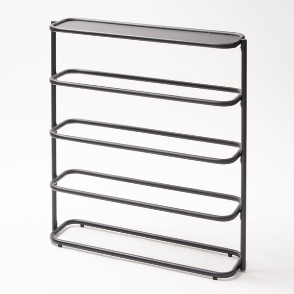 Apto Obround Shoe Rack Tall Steel Black is a modern two-in-one shoe rack and entryway table. Stylish storage for your shoes and everything you need to get out the door on time. With room for up to 12 pairs of shoes, this rack is perfect for keeping your go-to shoes by the door or putting your favorite pairs on display. Designed with your home in mind. The bottom of each shoe rack is outfitted with silicone footers to protect your floor from any damage. SKU 10487.