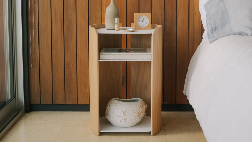 APTO Contour Side Table - Steel + Wood - White. SKU 10488. A clean, modern side table that complements any room. Perfect height for beside the bed or next to your favorite chair. Sleek design with practical storage. Quality materials for lasting beauty.