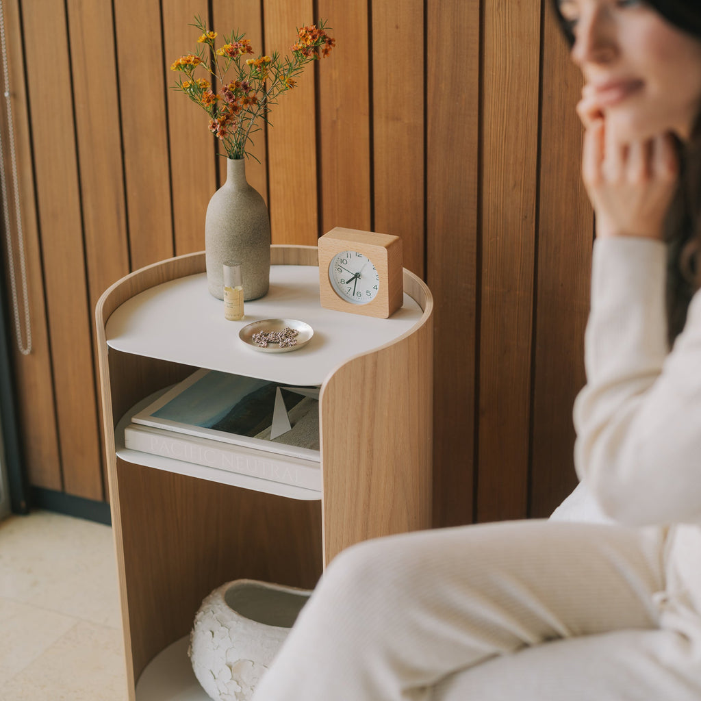 APTO Contour Side Table - Steel + Wood - White. SKU 10488. Bring style and function to any room with this modern three-tier steel and wood side table. Designed with your lifestyle in mind. The table features an opening in the back for easy cable management and charging. Balances modern steel surfaces with stylish molded plywood.