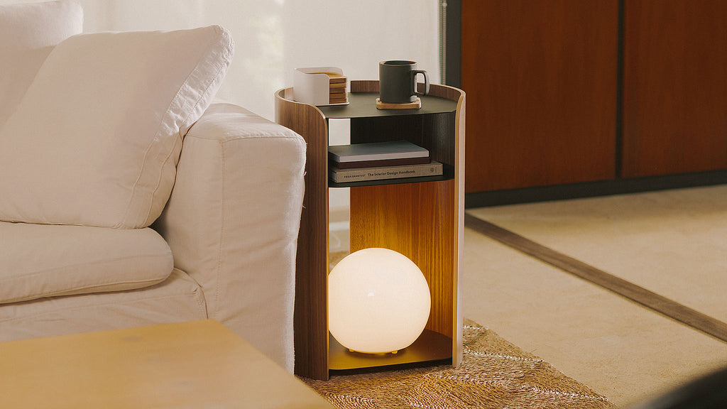 APTO Side Table - Steel + Wood - Black. SKU 10801. Bring style and function to any room with this modern three-tier steel and wood side table. Designed with your lifestyle in mind. The table features an opening in the back for easy cable management and charging. Balances modern steel surfaces with stylish molded plywood.