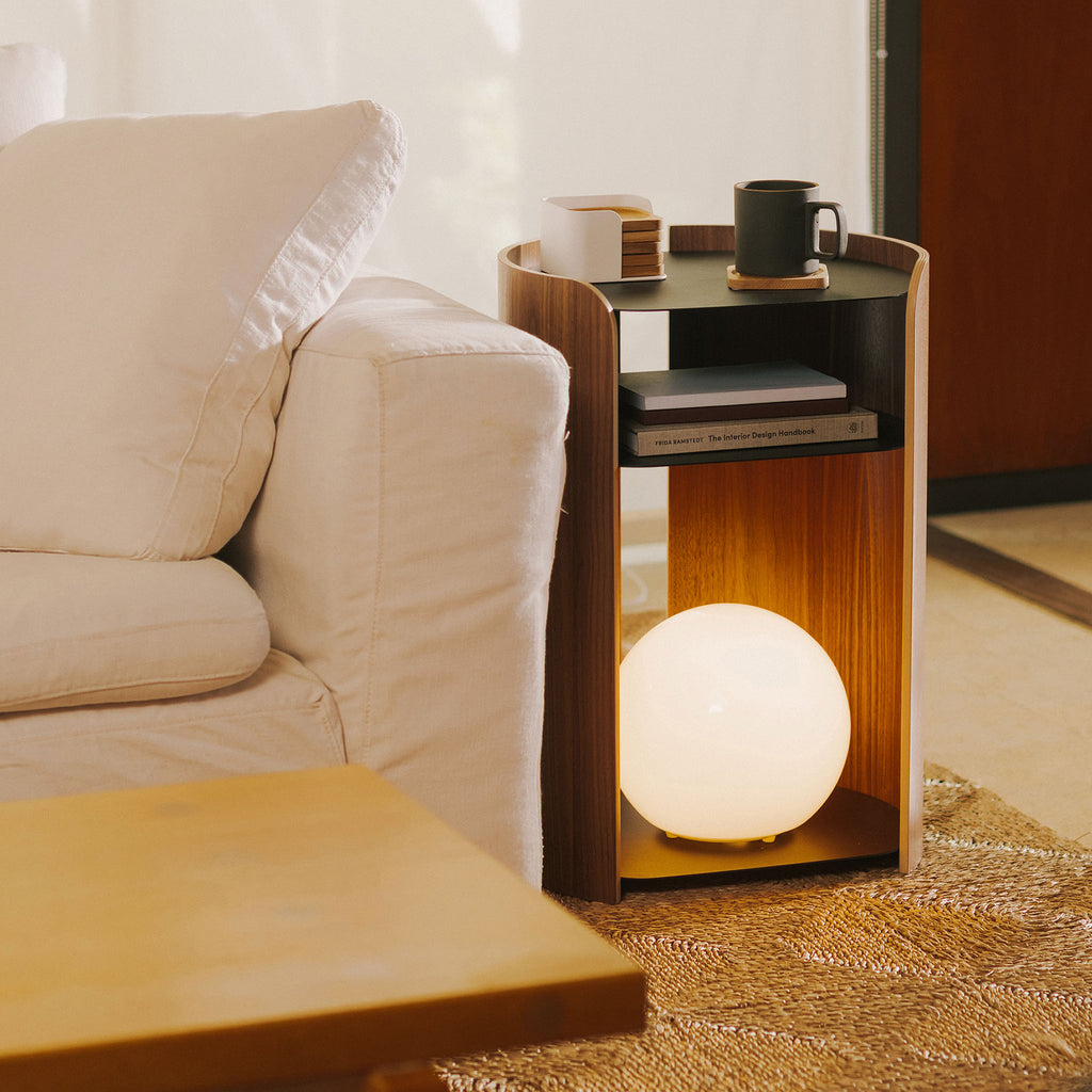 APTO Side Table - Steel + Wood - Black. SKU 10801. Bring style and function to any room with this modern three-tier steel and wood side table. Designed with your lifestyle in mind. The table features an opening in the back for easy cable management and charging. Balances modern steel surfaces with stylish molded plywood.