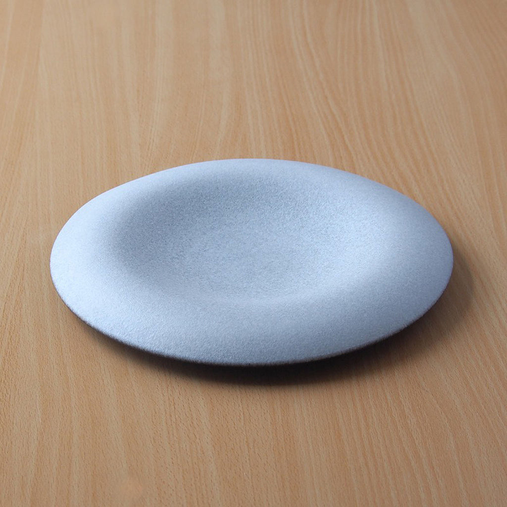 Confit 26cm / 10.2" plate dimensions: 26.5cm diameter x 3.3cm / 10.4" diameter x 1.3”; SKU 154-0041. Confit Plate features beautiful curves and a smooth texture. It envelops and highlights your food. Simply place food in the center for an elegant presentation. The deep recesses make it suitable for serving dishes with lots of liquid.