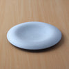 Confit 26cm / 10.2" plate dimensions: 26.5cm diameter x 3.3cm / 10.4" diameter x 1.3”; SKU 154-0041. Confit Plate features beautiful curves and a smooth texture. It envelops and highlights your food. Simply place food in the center for an elegant presentation. The deep recesses make it suitable for serving dishes with lots of liquid.