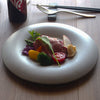 Confit 26cm / 10.2" plate SKU 154-0041. Sensui Maeda Soko offers modern tableware that nourishes not only the body but also the heart. Imagining the smiles and happiness of family and friends, home chefs enjoy cooking and carefully plating their dishes. Sensui Maeda Soko delivers thoughtfully crafted tableware from Seto, Japan—a renowned center of ceramic and porcelain production. All plates are dishwasher and microwave safe. All made and imported from Japan.