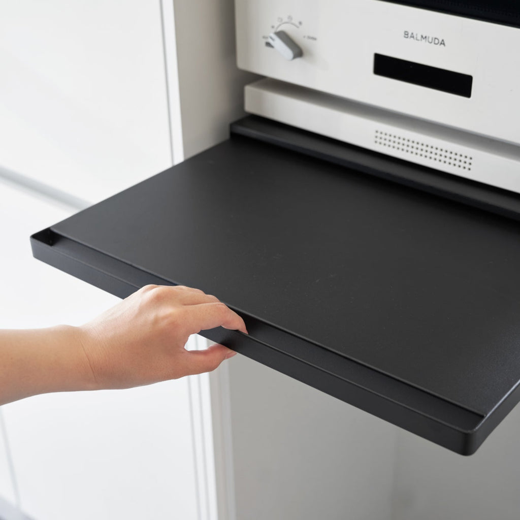 The vanishing pull-out shelf also provides ample space to perch a mug while you perfect your morning beverage, or rest that bowl of leftovers you just microwaved so you can season it up before carrying it to the table. 