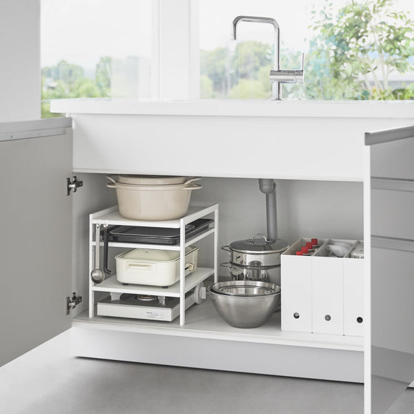 This three-tier steel kitchen storage rack is your helpful aid for cabinet organization! Adjust the bottom two shelves as you wish to store baking sheets, electric burners, pots and pans, and other bulky kitchen appliances that are otherwise hard to store. An effective solution to keep your cleaning tools in check under the kitchen sink, and even bathroom cabinets.