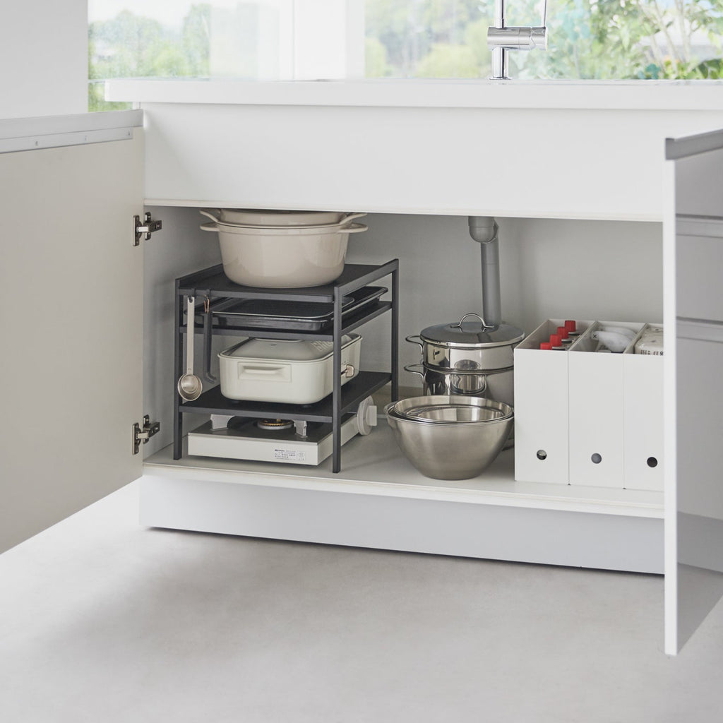 This 3 tier kitchen storage rack is the key to cabinet organization! Make the most of vertical storage space with its adjustable shelves and hooks.