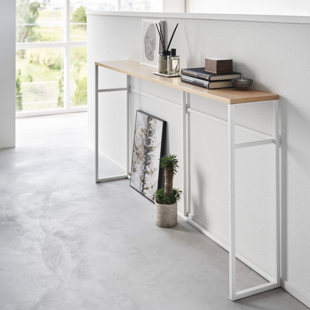 This luxuriously long yet stealthily slim console table will add just the extra storage you need in your entryway or maximize the space behind the couch or sofa. 