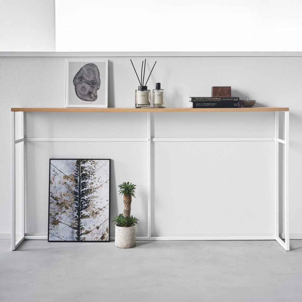 This luxuriously long yet stealthily slim console table will add just the extra storage you need in your entryway or maximize the space behind the couch or sofa. 
