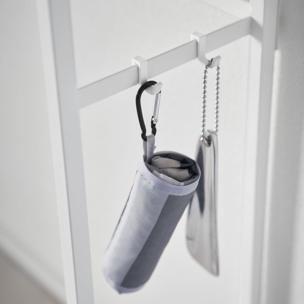 Keep your living room or entryway essentials on the table, umbrellas and other hanging items on the hooks, and perhaps top it off with some decor items to accentuate your space.