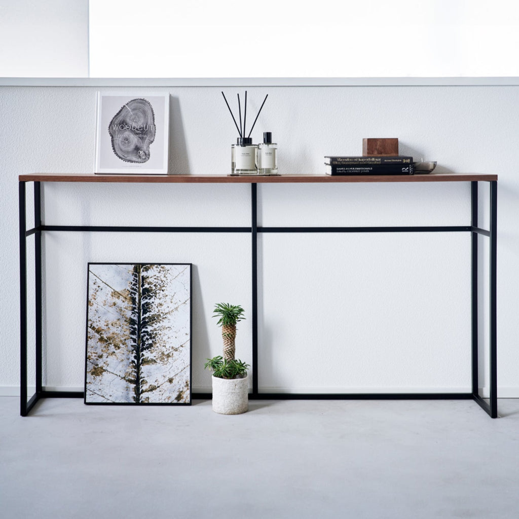 This luxuriously long yet stealthily slim console table will add just the extra storage you need in your entryway or maximize the space behind the couch or sofa. 