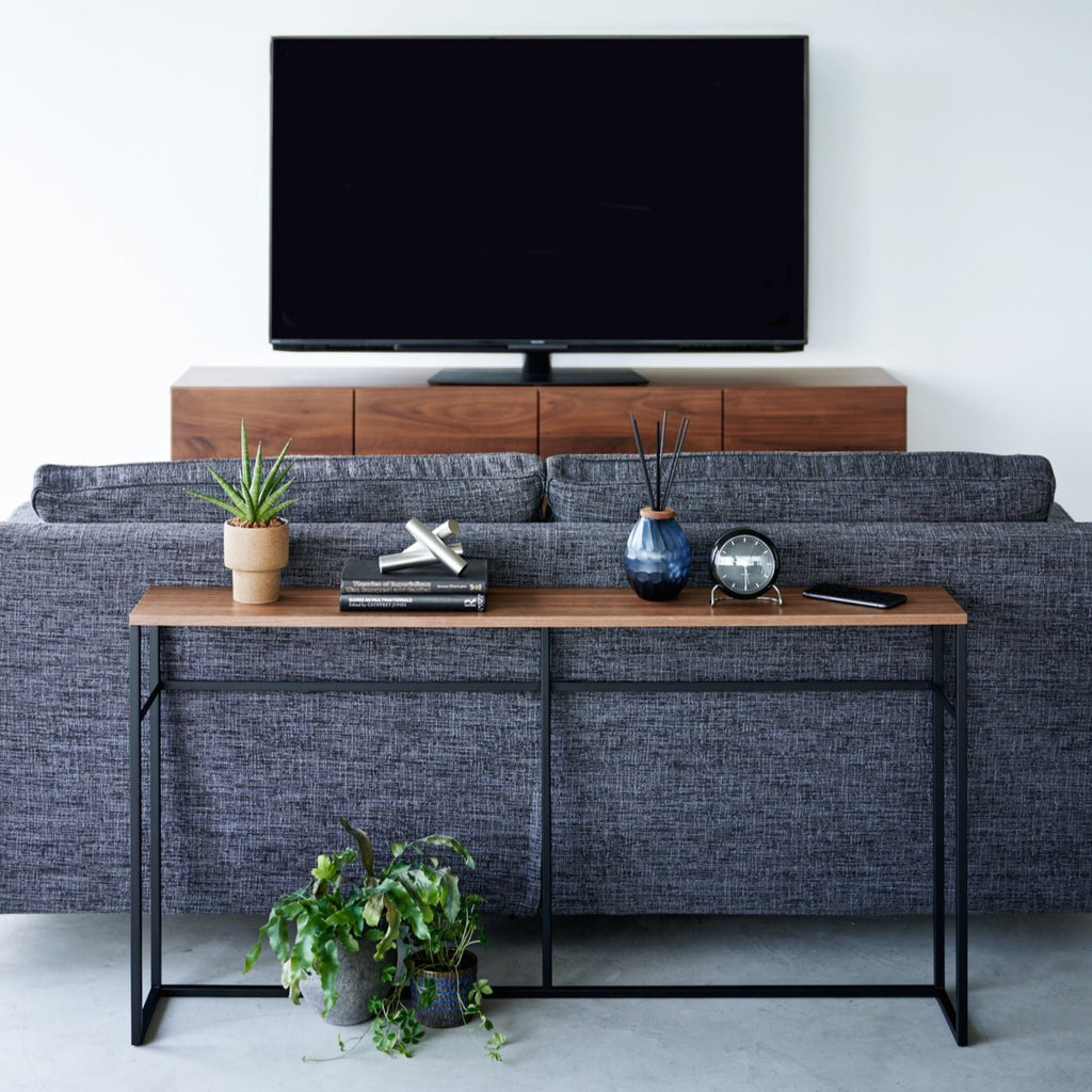 The long design makes this table an ideal addition for the area behind your sofa, which is prone to becoming dead space. Add some flair with indoor plants or decor items while also providing a convenient ledge for your remote controls, books, and other living room items.