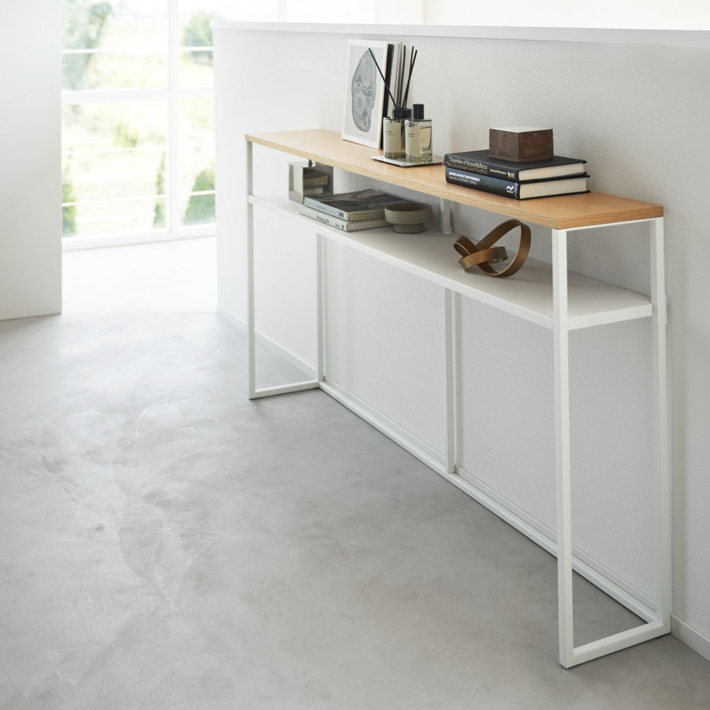 Shelf version provides extra storage for books, remote controls, and other knickknacks.