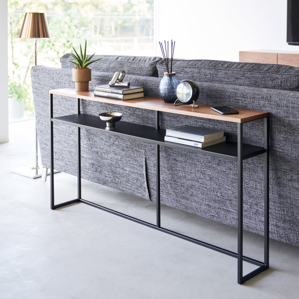With a natural woodgrain top and minimalistic steel legs, this sleek design magically makes everything placed upon it look intentionally styled. 