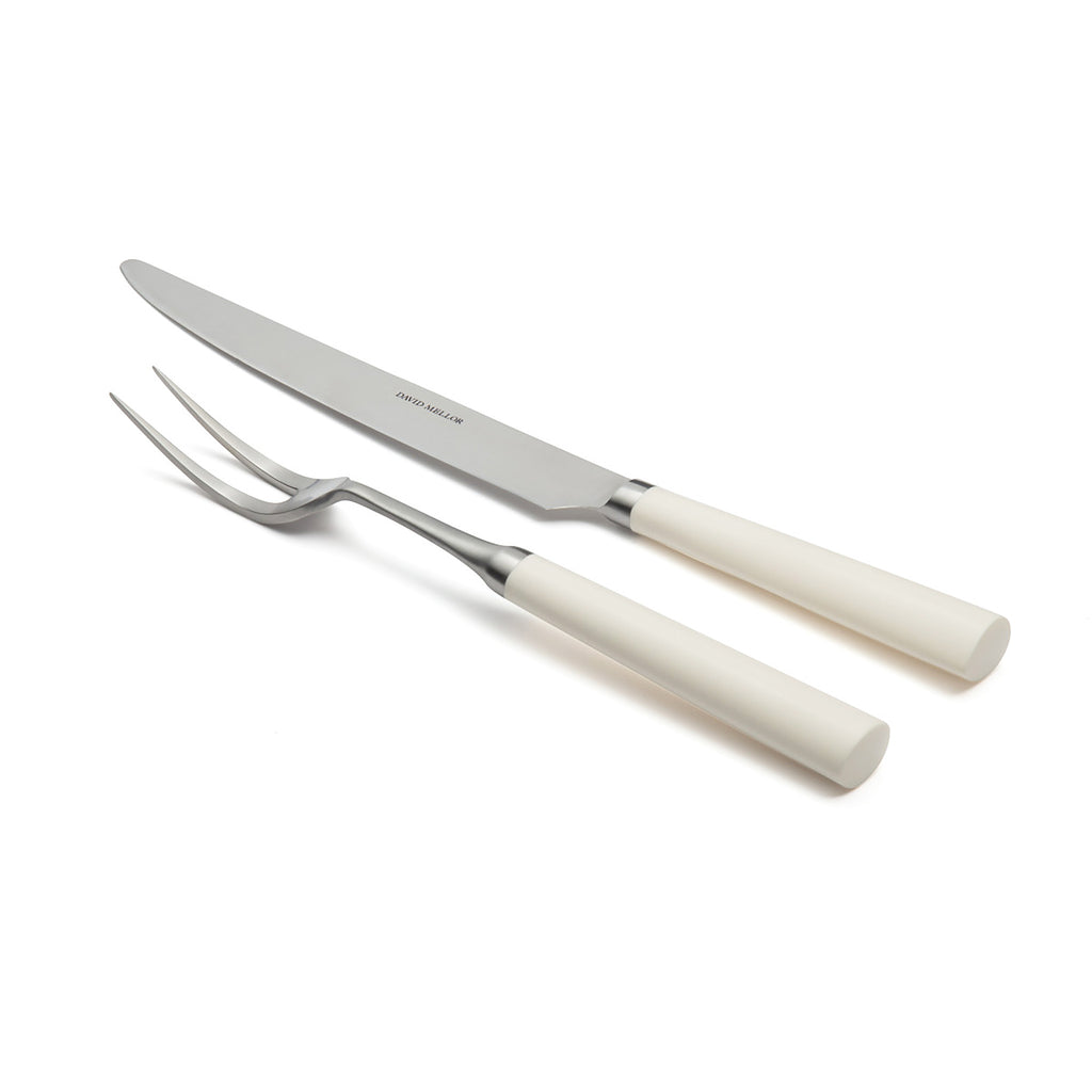 David Mellor Pride carving set. Carving Knife 20cm. Carving Fork 25.5cm. SKU 2518310. Expertly hand finished with ivory colored handles. Super-sharp high carbon stainless steel blade has been ice-hardened to minus 80ºc.