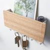 Best of all, the rack is just 7 inches wide and has five hooks and room for a few letters.