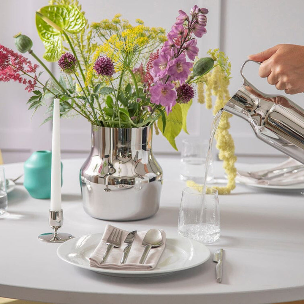 Made from recycled 18/10 stainless steel (SS304), this candlestick is part of the Dorotea collection - an homage to the natural area surrounding the small village of Dorotea. Here, ice has sculpted a landscape of mountains, valleys, and expansive open spaces, creating soft, fluid shapes that flow seamlessly into one another. This often-overlooked transition is where the true spirit of the design comes to life - subtle, yet full of depth and discovery. 