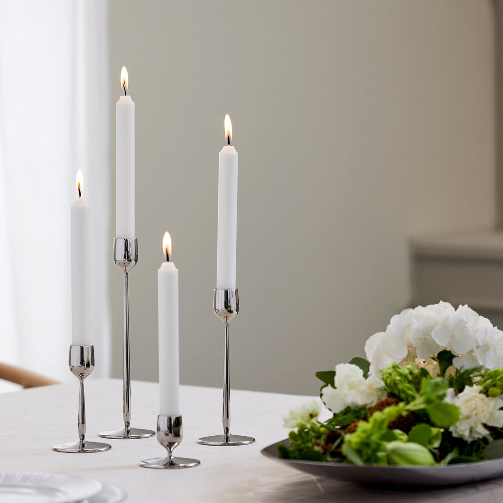Made from recycled 18/10 stainless steel (SS304), this candlestick is part of the Dorotea collection - an homage to the natural area surrounding the small village of Dorotea. Here, ice has sculpted a landscape of mountains, valleys, and expansive open spaces, creating soft, fluid shapes that flow seamlessly into one another. This often-overlooked transition is where the true spirit of the design comes to life - subtle, yet full of depth and discovery. 