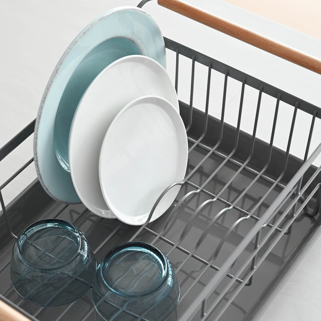 Draining tray is designed to catch any water that drips down, with sufficient depth to minimize splashing. Periodically remove the tray to empty any water into the sink. Wash with soap and warm water to clean.