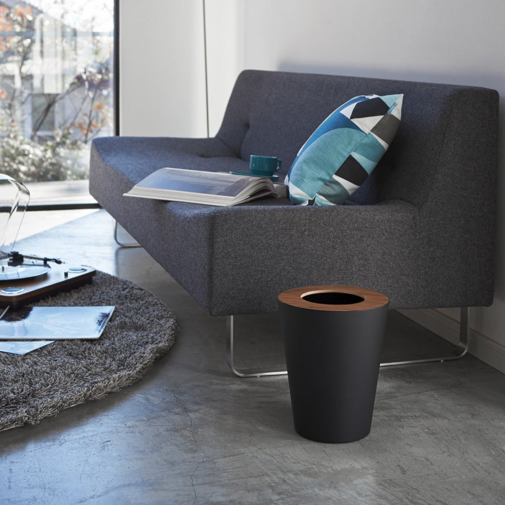 Is your home riddled with ugly plastic trash cans? Bin them and try these classy and modern waste baskets. The wooden lid adds a charming accent while also secretly hiding the waste within! An inner ring holds a bin liner in place discreetly and invisibly. Smart and stylish. Designed in Japan.