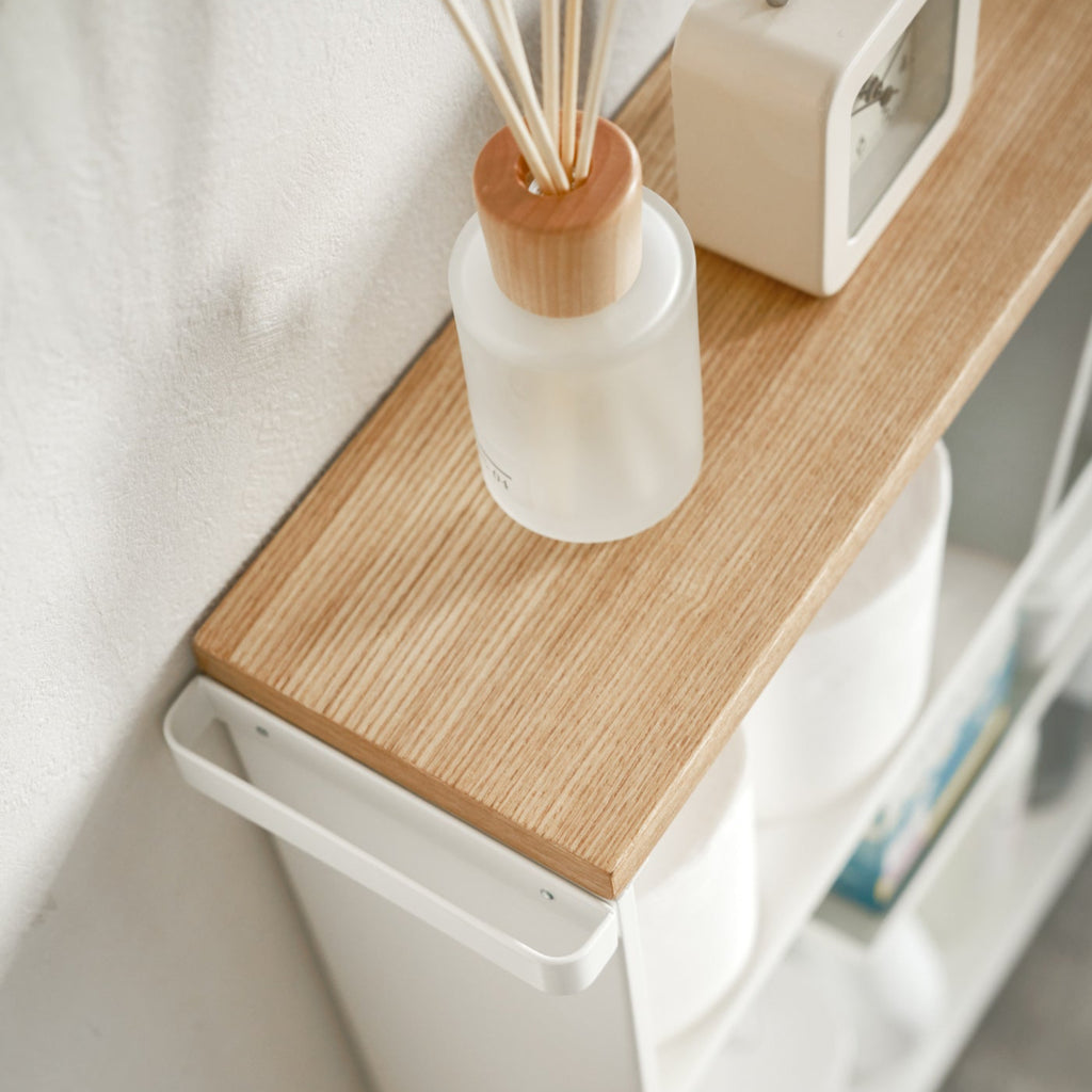 Restoring order and maximizing storage space in any room of the home. The adjustable handle, smooth wooden tabletop, and inner shelves all add to the function and style of this rolling cart.