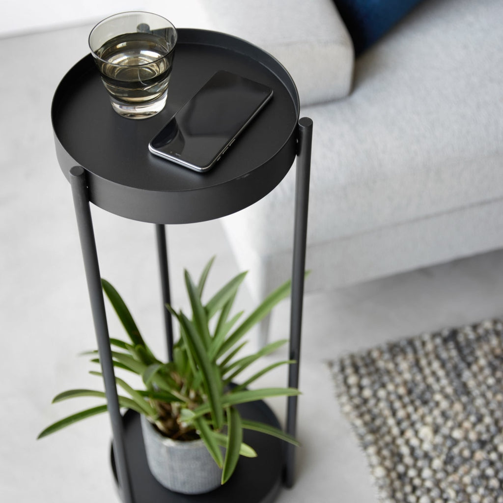 Place it next to your couch and use the top tier as a side table, or wheel it up to your windows so your plants can catch more sun.