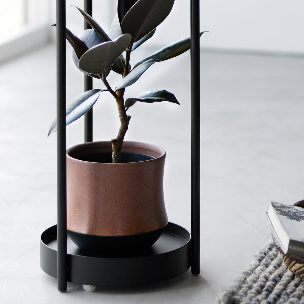 With a lightweight frame and caster wheels, this corner plant stand can easily be moved and placed anywhere in your home. 