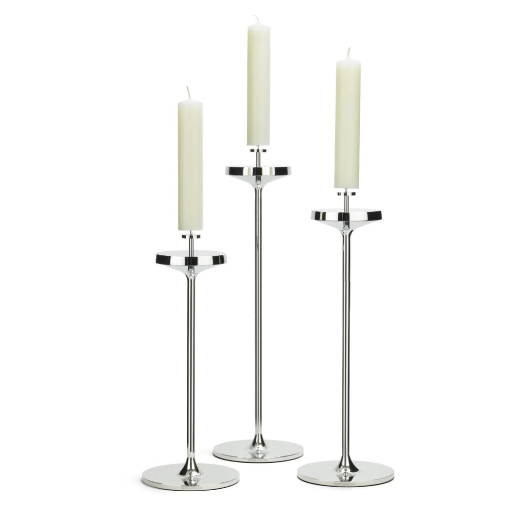 David Mellor Embassy stainless steel candlesticks. Originally designed in 1963 for use in British embassies abroad and previously only available in silver plate, we are pleased to now introduce a stainless steel version of this design classic. These spectacular candlesticks add real height and elegance to a table setting. Use individually or group together different heights.