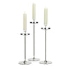 David Mellor Embassy stainless steel candlesticks. Originally designed in 1963 for use in British embassies abroad and previously only available in silver plate, we are pleased to now introduce a stainless steel version of this design classic. These spectacular candlesticks add real height and elegance to a table setting. Use individually or group together different heights.
