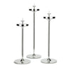 David Mellor Embassy stainless steel candlesticks. Originally designed in 1963 for use in British embassies abroad and previously only available in silver plate, we are pleased to now introduce a stainless steel version of this design classic. These spectacular candlesticks add real height and elegance to a table setting. Use individually or group together different heights.
