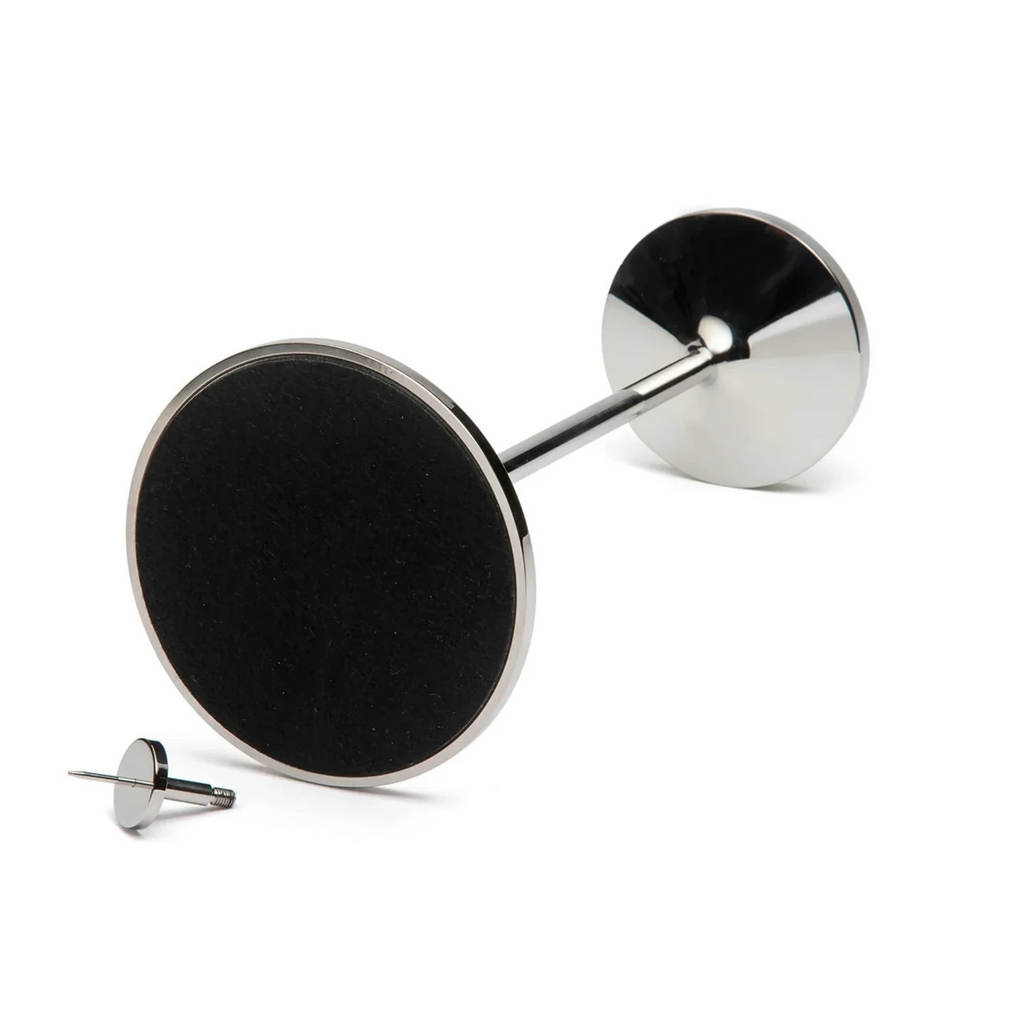 David Mellor Embassy stainless steel candlesticks. Originally designed in 1963 for use in British embassies abroad and previously only available in silver plate, we are pleased to now introduce a stainless steel version of this design classic. These spectacular candlesticks add real height and elegance to a table setting. Use individually or group together different heights.