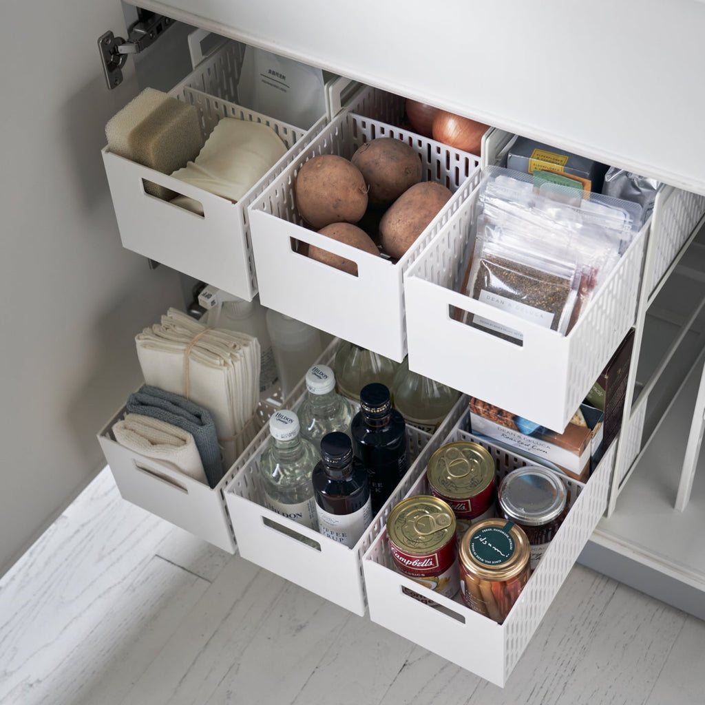 Reinvent cabinet storage with this two-tier solution, designed to revive any dead vertical space! These racks are fully modular with dividing walls to customize the storage compartments on each level. From toiletries to cleaning items, make full use of your space and enjoy the convenience of the pull-out drawers. The bins are designed to ventilate, so you can even use them in the pantry to keep staple vegetables in stock!