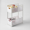 Yamazaki Home Tower Two-Tier Cabinet Storage Basket White SKU 5218. Optimize under-sink space with our 2-tiered storage basket. Keep your essentials neatly arranged while making the most of valuable space.