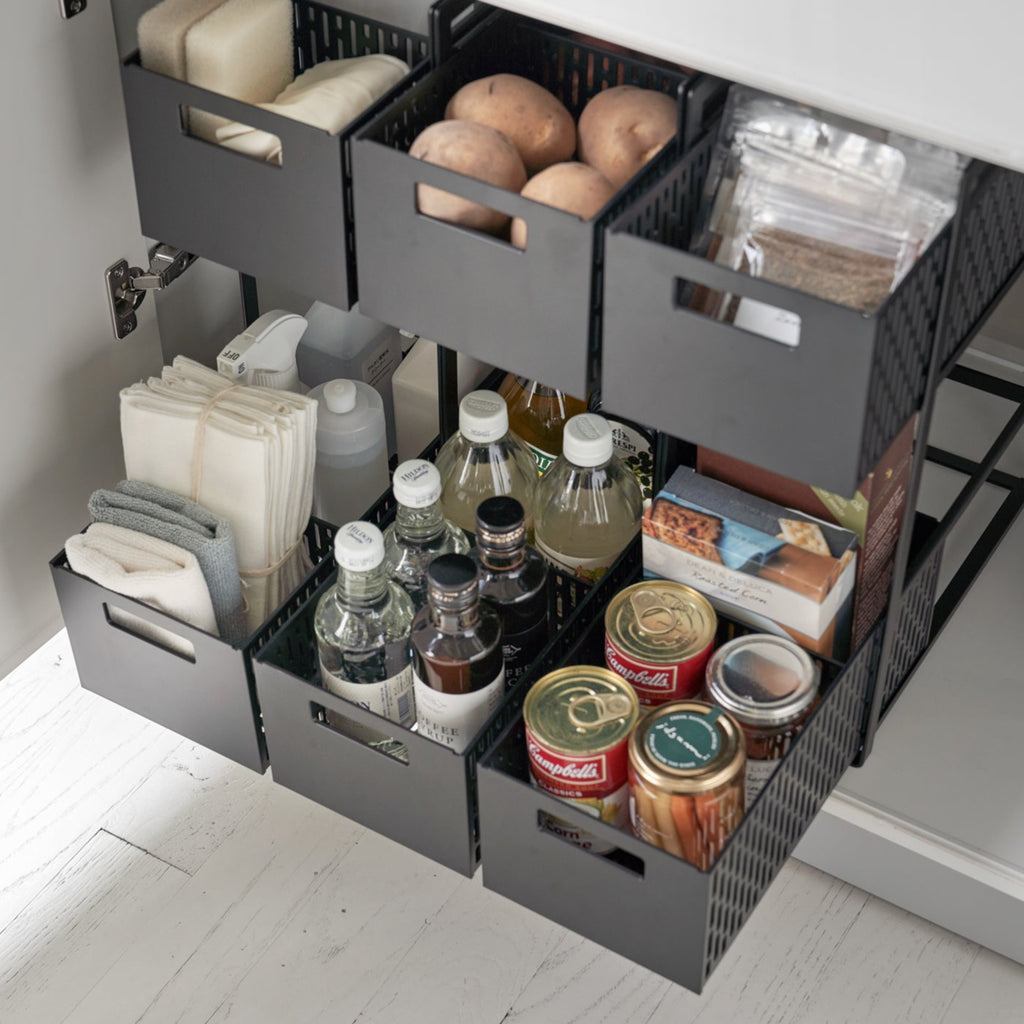 Reinvent cabinet storage with this two-tier solution, designed to revive any dead vertical space! These racks are fully modular with dividing walls to customize the storage compartments on each level. From toiletries to cleaning items, make full use of your space and enjoy the convenience of the pull-out drawers. The bins are designed to ventilate, so you can even use them in the pantry to keep staple vegetables in stock!