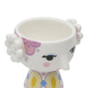 Each set includes two tealight holders: one with yellow and one with lavender 'hair', both adorned with delightfully vibrant painted dresses. 