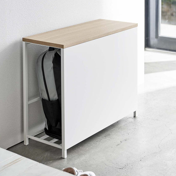 The steel and natural woodgrain top make for a handsome addition to your space. Use the top surface as a place for your plants or decoration, a pit stop for your handbags and purses while you get ready to head out, or as a bench.