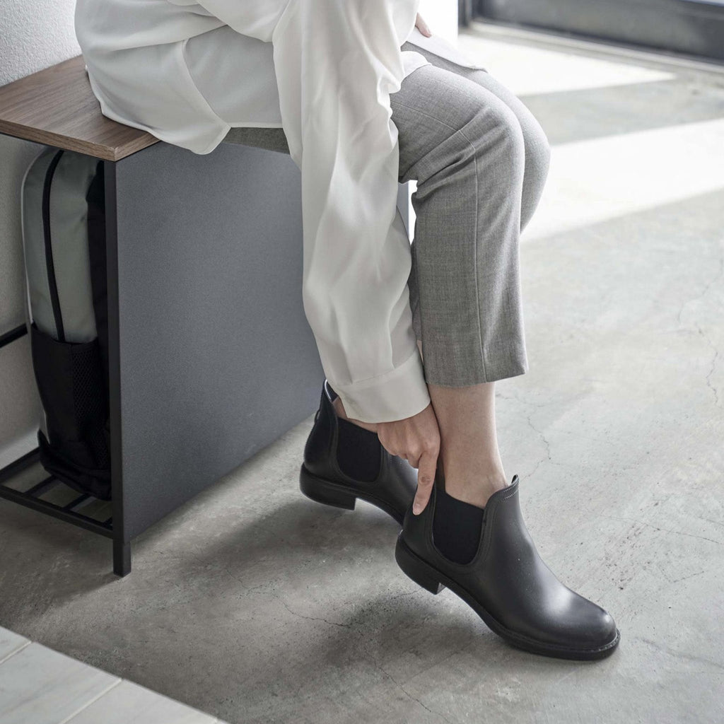 Better yet, it also doubles as a bench so you can easily tie your shoelaces or fasten buckles, as well as provide a convenient perch for your bags and purses when you walk in the door.