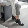Better yet, it also doubles as a bench so you can easily tie your shoelaces or fasten buckles, as well as provide a convenient perch for your bags and purses when you walk in the door.