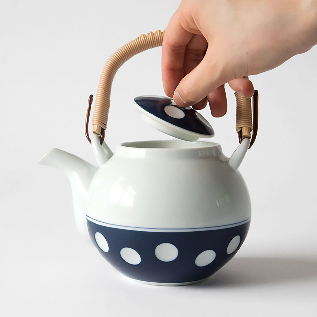 Soesen Mizutama Maru Dobin (Round with Arched Handle) Teapot. SKU 62496. Mizutama means "polka dots" in Japanese. Synonymous with Hizen Yoshida ware, this pattern is attributed to white stones at the bottom of the Narutani River in the upper stream of Haguchi River running through Yoshida village. Mizutama teaware is now a staple and symbol for the Japanese dining table. 