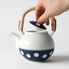 Soesen Mizutama Maru Dobin (Round with Arched Handle) Teapot. SKU 62496. Mizutama means "polka dots" in Japanese. Synonymous with Hizen Yoshida ware, this pattern is attributed to white stones at the bottom of the Narutani River in the upper stream of Haguchi River running through Yoshida village. Mizutama teaware is now a staple and symbol for the Japanese dining table. 