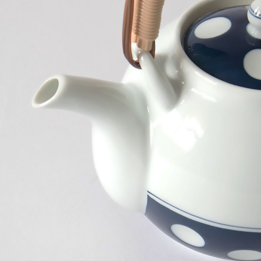 SKU 62496 Soesen Mizutama Maru Dobin (Round with Arched Handle) Teapot. Dimensions: 4.5” H. X 4.5” diameter. Material: porcelain; bamboo/rattan. Capacity: 17.75 fl.oz. / 525 mL. Care: dishwasher and microwave safe.