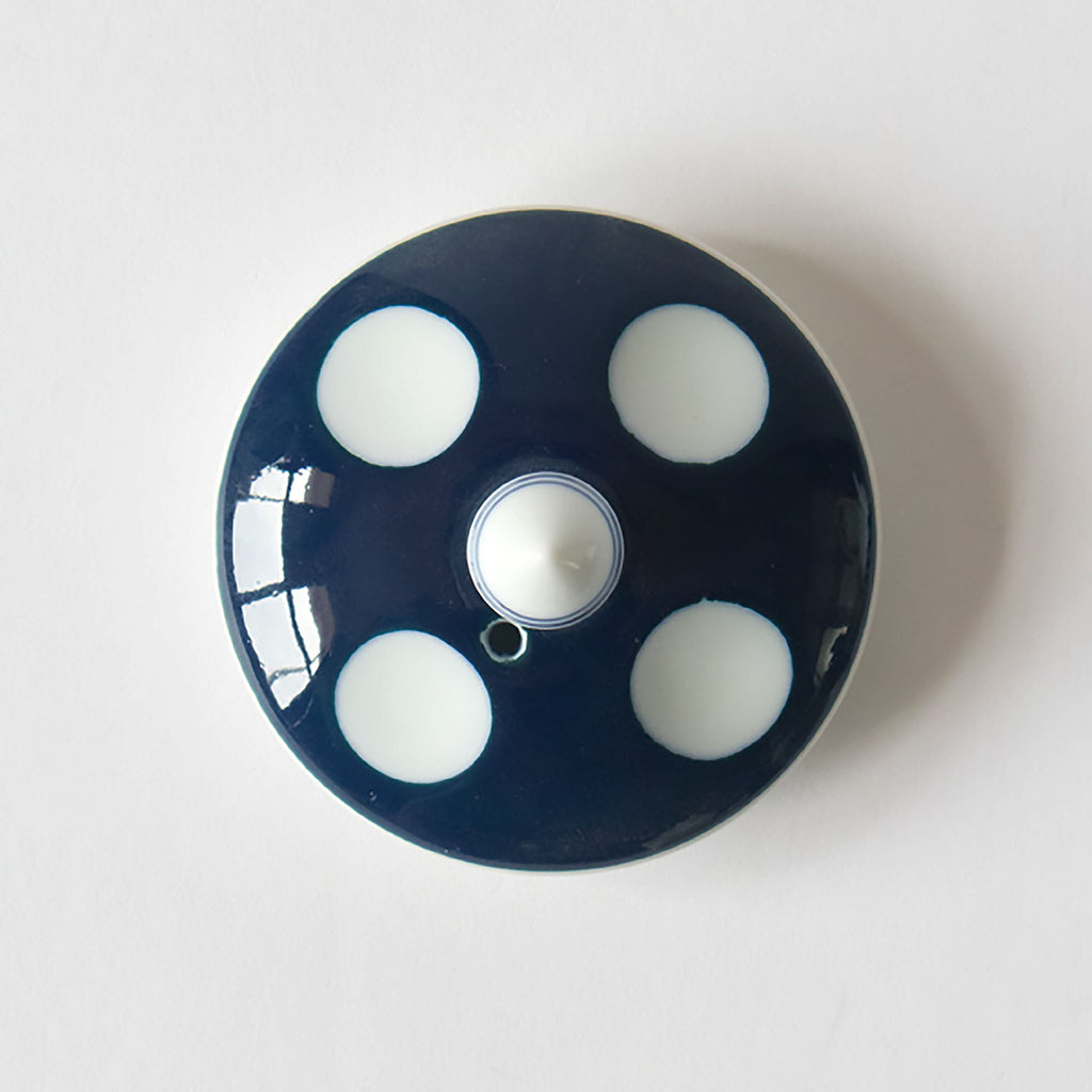 Mizutama means "polka dots" in Japanese. Synonymous with Hizen Yoshida ware, this pattern is attributed to white stones at the bottom of the Narutani River in the upper stream of Haguchi River running through Yoshida village. Mizutama teaware is now a staple and symbol for the Japanese dining table. SKU 62496.