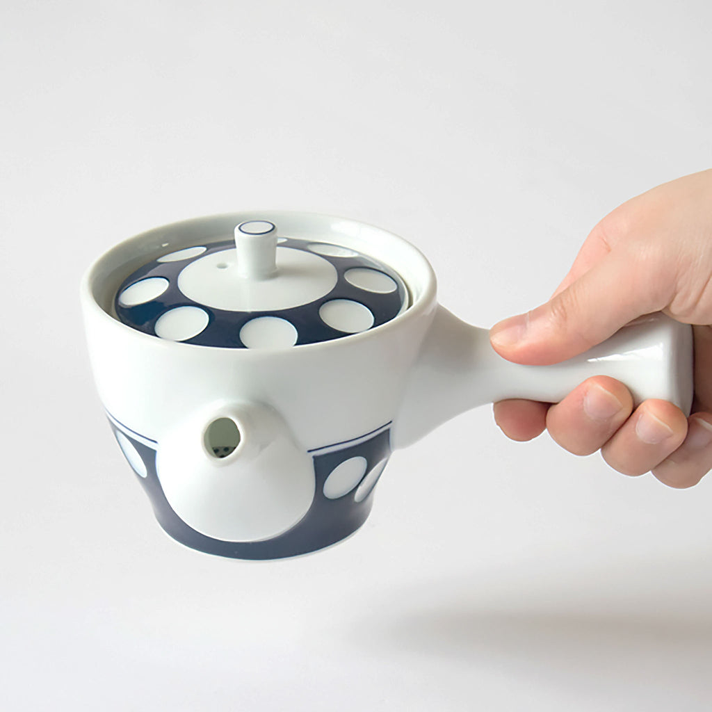 Mizutama teaware is now a staple and symbol for the Japanese dining table. Soesen Kiln craftsmen continue the traditional technique of hand making every part of the tea ware and hand-carving each piece to create the indented polka-dot design. 
